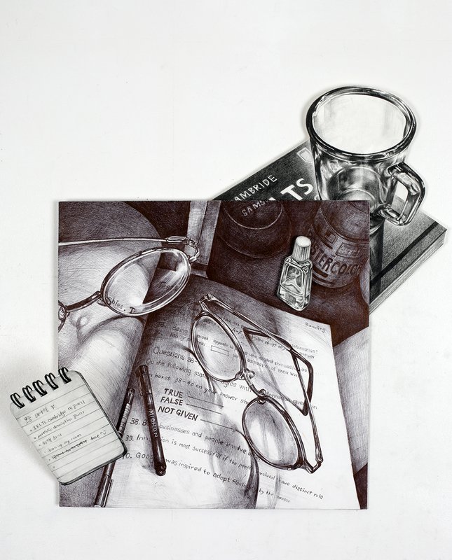 Hyperrealistic graphite pencil still life of two pairs of eyeglasses resting on an open English exam paper, alongside a transparent glass mug, books, a small bottle, and a notepad arranged on a flat surface.