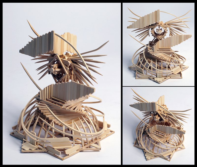 Abstract sculptural form constructed entirely from layered and interlocking wooden craft sticks and balsa strips, creating a dynamic creature-like figure with spiky protrusions and curved structural ribs, photographed from three angles.