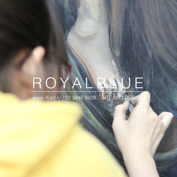 A Royal Blue student working closely on a large dark figurative painting, applying paint with a brush near the canvas in a studio with the Royal Blue watermark overlay
