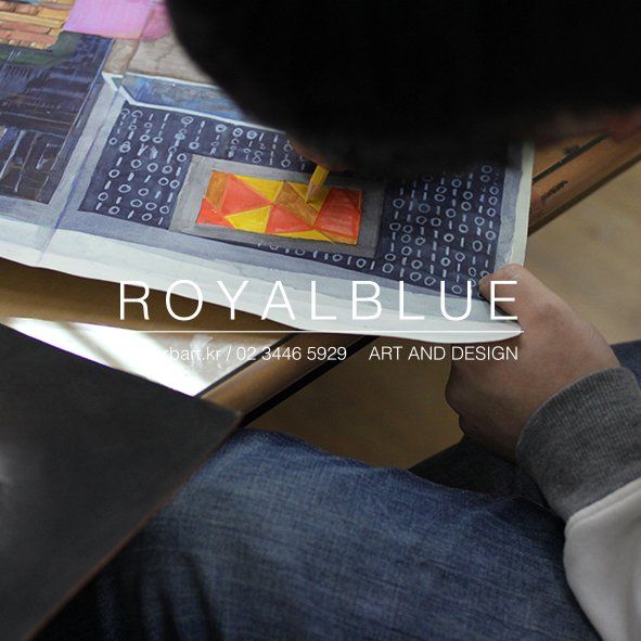 Royal Blue branded close-up photograph of a student using a digital device or drawing tablet alongside traditional art references on a Royal Blue studio desk