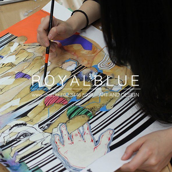 Royal Blue branded overhead photograph of a student's hands working on a large mixed-media artwork with diagonal and angular elements, showing detailed fine-line work
