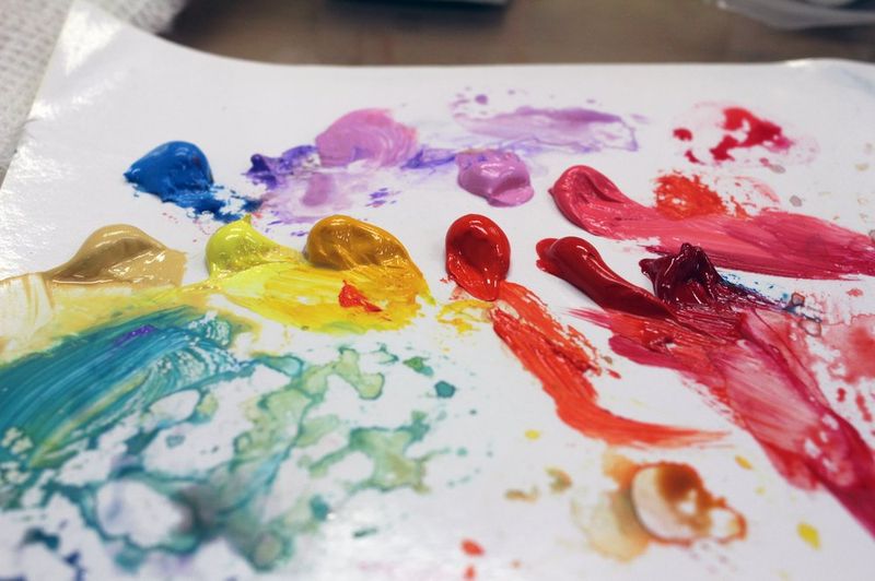 Close-up photograph of a silver metal Royal Blue nameplate or door plaque featuring a royal crest emblem and the studio name engraved in formal typography