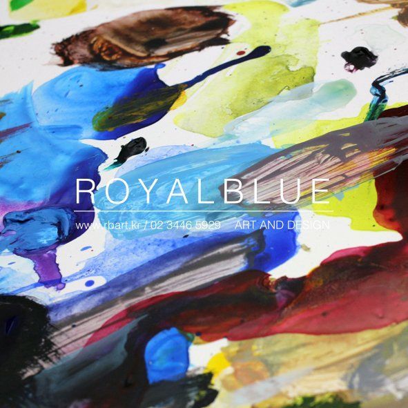 A Royal Blue branded promotional image featuring close-up of colorful watercolor paint splashes and brushstrokes in vivid blues, yellows, and reds with studio branding overlay
