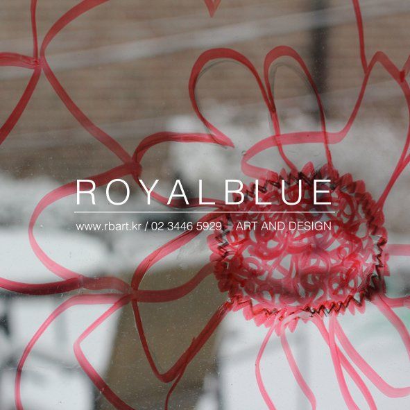 A Royal Blue branded promotional image showing a close-up of a delicate red line drawing of a flower or organic form on white background with studio logo overlay