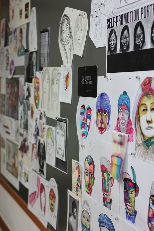 Student illustration and drawing portfolio displayed on studio wall at Royal Blue Art & Design, Apgujeong Seoul