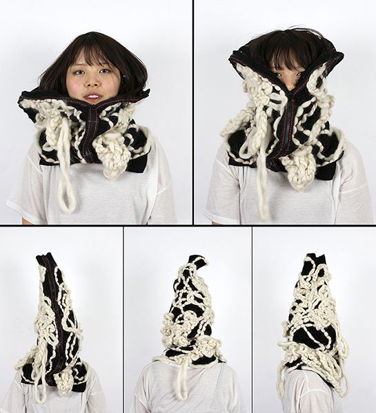 A fashion design series featuring a young female figure wearing bold black-and-white cow-print garments including a coat and flowing dress, photographed against a plain white background in multiple poses